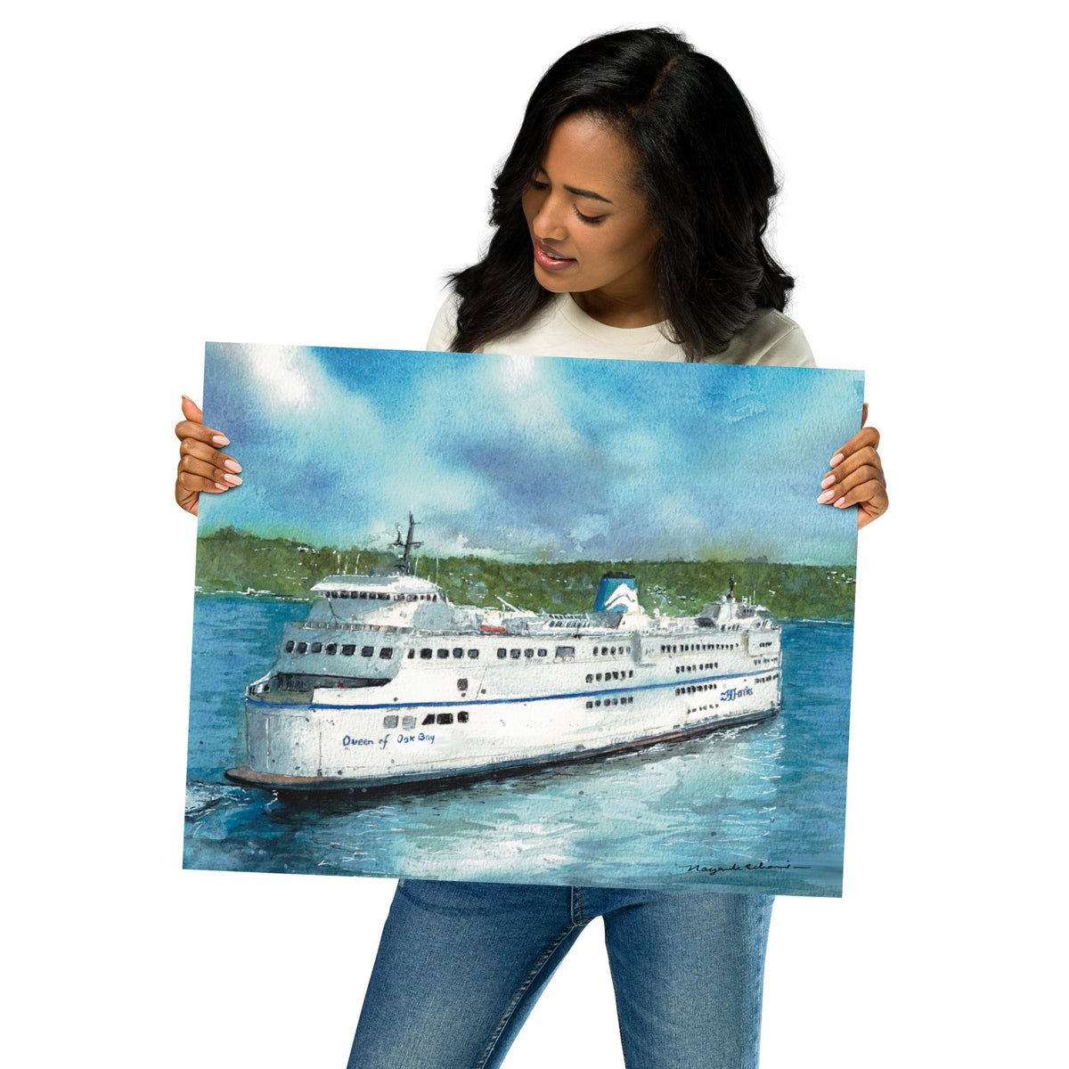 Model in a light top holding the unframed Queen of Oak Bay print at an angle; the landscape watercolor shows a white ferry on blue water with a green shoreline and cloud-filled sky.