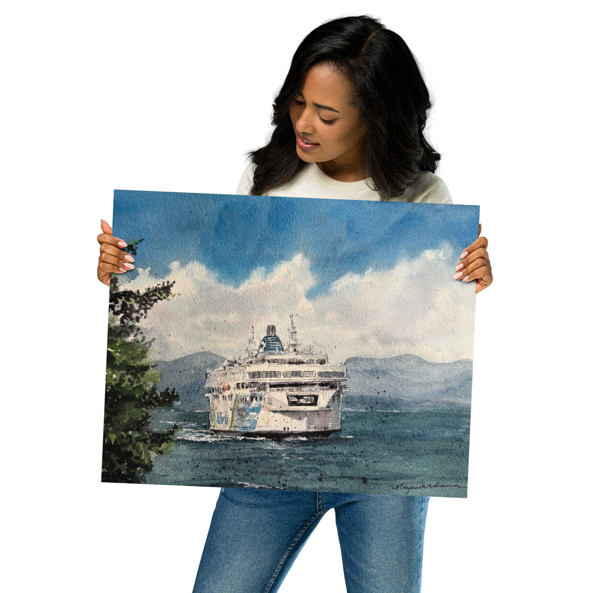 Model in a light top holding the unframed Coastal Inspiration Approaching Duke Point print at an angle; Coastal Inspiration approaching Duke Point head-on across deep blue water, with an evergreen foreground, distant mountains and billowing white clouds.