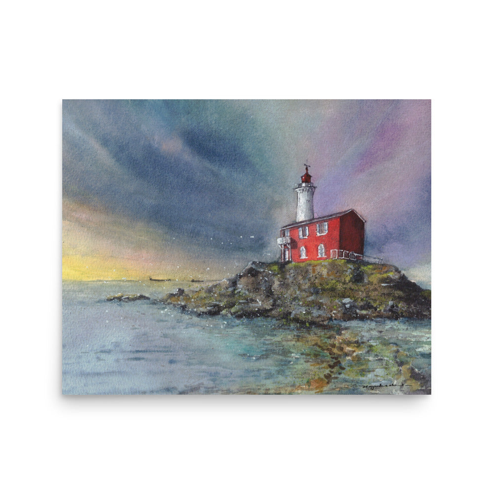 Fisgard Lighthouse on a rocky shoreline beneath a dramatic blue, violet and yellow sky, with the red keeper's house reflected in calm coastal water, shown as an unframed landscape print against a white background.