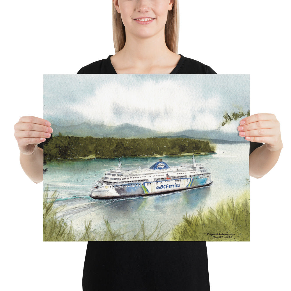 Model in a black top holding the unframed Coastal Renaissance in Active Pass landscape print; Coastal Renaissance travelling through blue-green water in Active Pass, framed by grassy shoreline, forested islands and misty mountains.